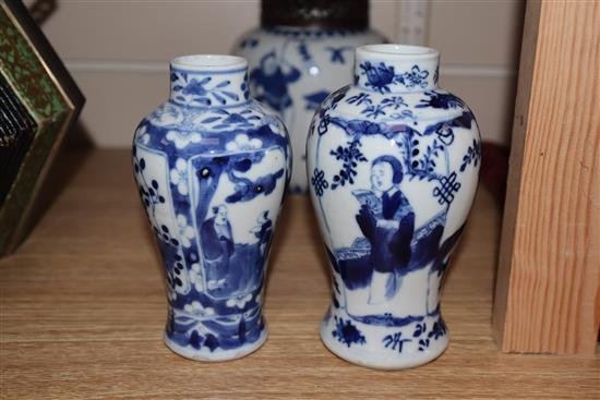 A 19th century Chinese blue and white ovoid jar, wood cover and two similar smaller vases tallest 15cm